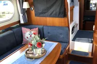 Luxurious interior of 2007 Nimbus 380 Commander yacht with elegant seating and nautical decor.