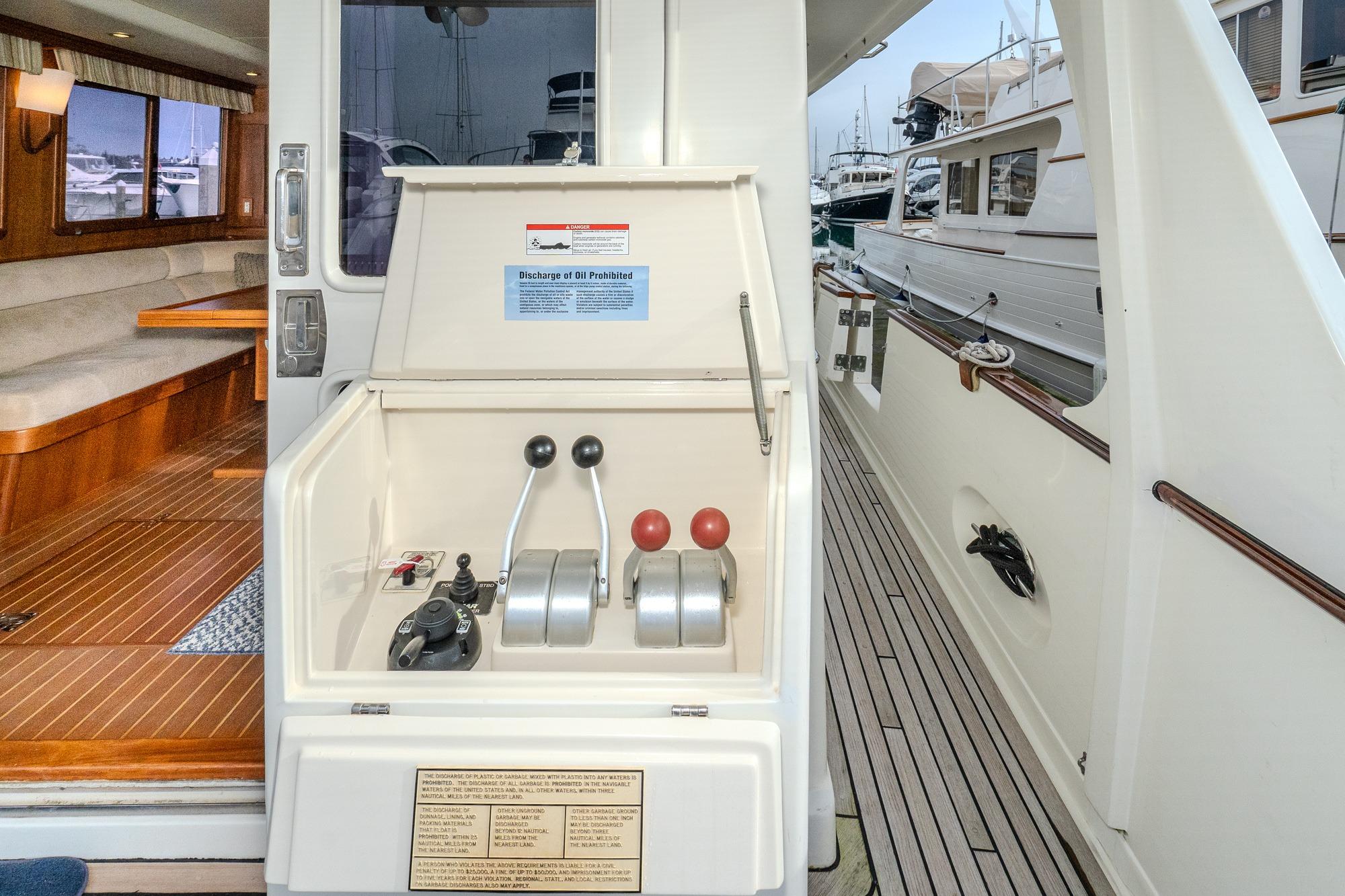 2001 Fleming 55 Pilothouse yacht controls and interior view at dock.