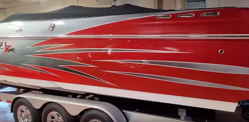  Yacht Photos Pics 2008 Donzi 35 ZR speedboat with red and silver graphics on a trailer.