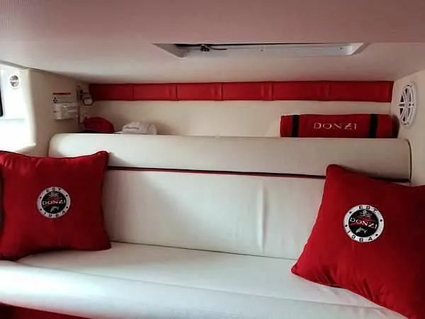  Yacht Photos Pics Interior of 2008 Donzi 35 ZR boat with red and white seating and branded cushions.
