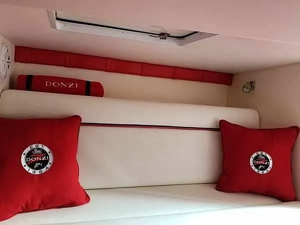  Yacht Photos Pics 2008 Donzi 35 ZR cabin interior with red cushions and white seating.