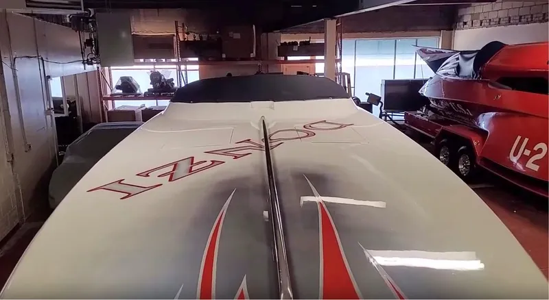  Yacht Photos Pics 2008 Donzi 35 ZR speedboat in a garage, showcasing sleek design and bold graphics.