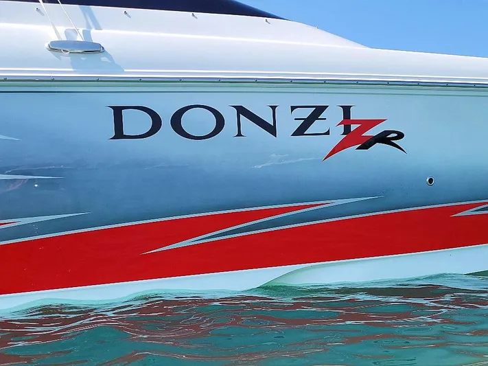  Yacht Photos Pics 2008 Donzi 35 ZR boat with sleek design and vibrant red accents on water.
