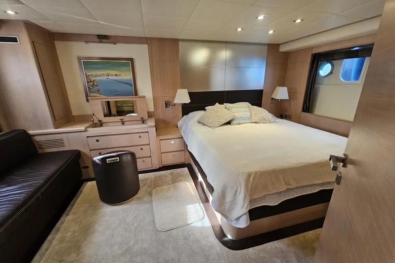 M/y Tivella Yacht Photos Pics Luxurious bedroom interior of 2009 VZ 68 yacht with modern furnishings and decor.