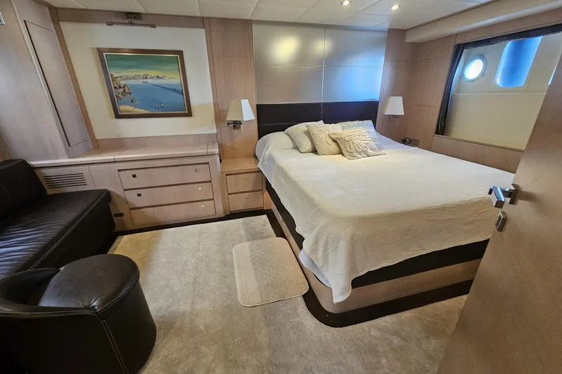 M/y Tivella Yacht Photos Pics Luxurious bedroom interior on 2009 VZ 68 yacht, featuring a cozy bed and elegant decor.