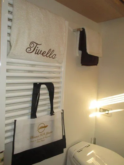 M/y Tivella Yacht Photos Pics Bathroom with towel rack, branded bag, and sunlight. VZ 68, 2009.