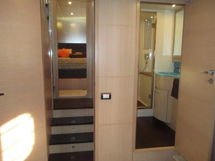M/y Tivella Yacht Photos Pics Interior of 2009 VZ 68 yacht showing stairs, bedroom, and bathroom.