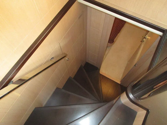 M/y Tivella Yacht Photos Pics Staircase inside 2009 VZ 68 yacht, featuring sleek wooden steps and modern design.