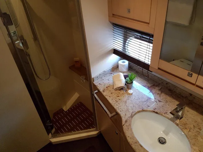 M/y Tivella Yacht Photos Pics Luxurious bathroom in 2009 VZ 68 yacht with granite countertop and shower.