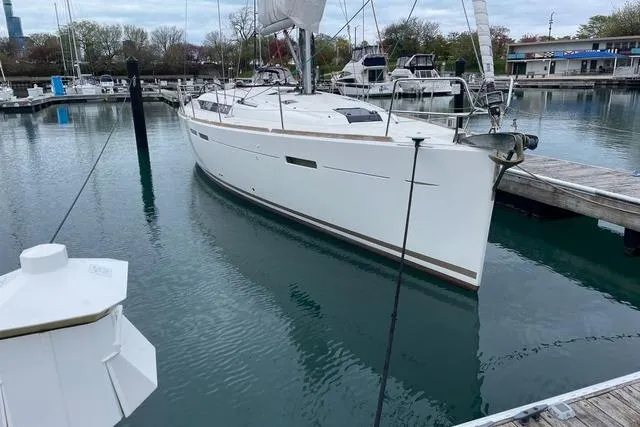 Eclipse Yacht Photos Pics 2014 Jeanneau Sun Odyssey 439 sailboat docked in a marina.