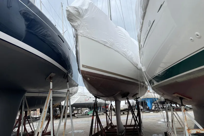 Eclipse Yacht Photos Pics 2014 Jeanneau Sun Odyssey 439 sailboat in dry dock, covered for storage.
