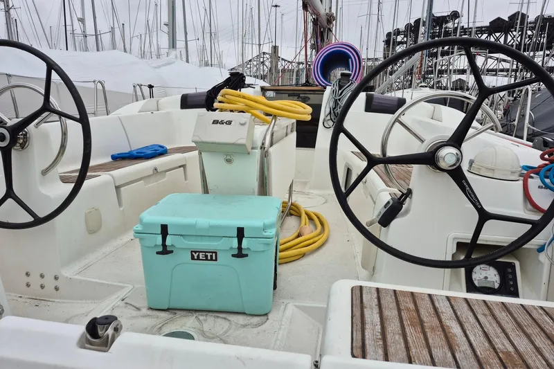 Eclipse Yacht Photos Pics Cockpit of 2014 Jeanneau Sun Odyssey 439 sailboat with dual steering wheels and Yeti cooler.