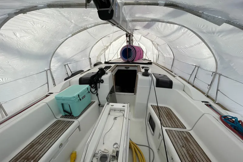 Eclipse Yacht Photos Pics Interior view of 2014 Jeanneau Sun Odyssey 439 sailboat under protective cover.