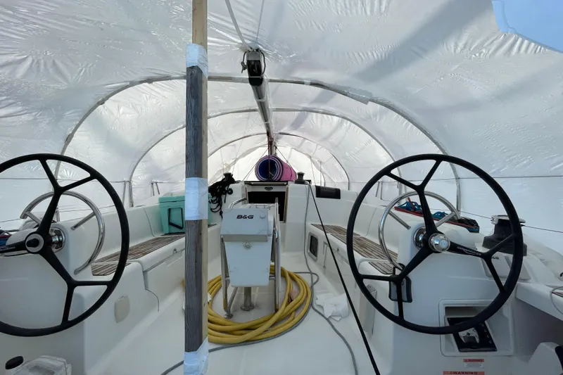 Eclipse Yacht Photos Pics Interior view of a 2014 Jeanneau Sun Odyssey 439 sailboat under protective cover.