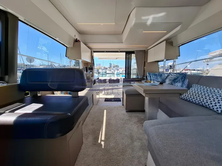  Yacht Photos Pics Luxurious interior of 2019 Prestige 420 Flybridge yacht with modern seating and large windows.