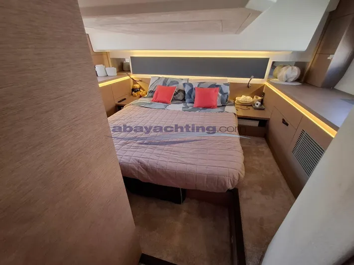  Yacht Photos Pics Luxurious bedroom interior of 2019 Prestige 420 Flybridge yacht with modern design and cozy bedding.