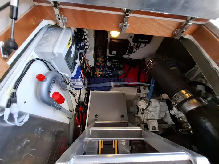  Yacht Photos Pics Engine room of 2019 Prestige 420 Flybridge Line yacht, showcasing mechanical components and wiring.