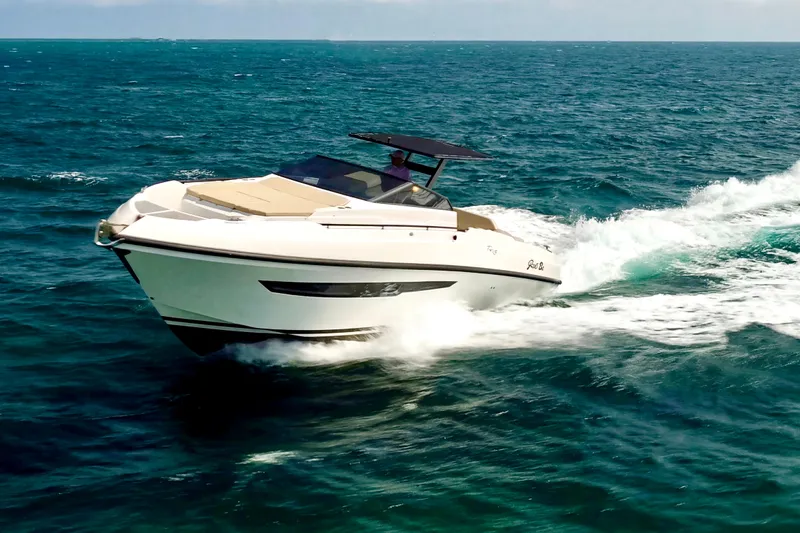  Yacht Photos Pics 2023 Rio Yachts Daytona 34 cruising on open sea, showcasing sleek design and performance.