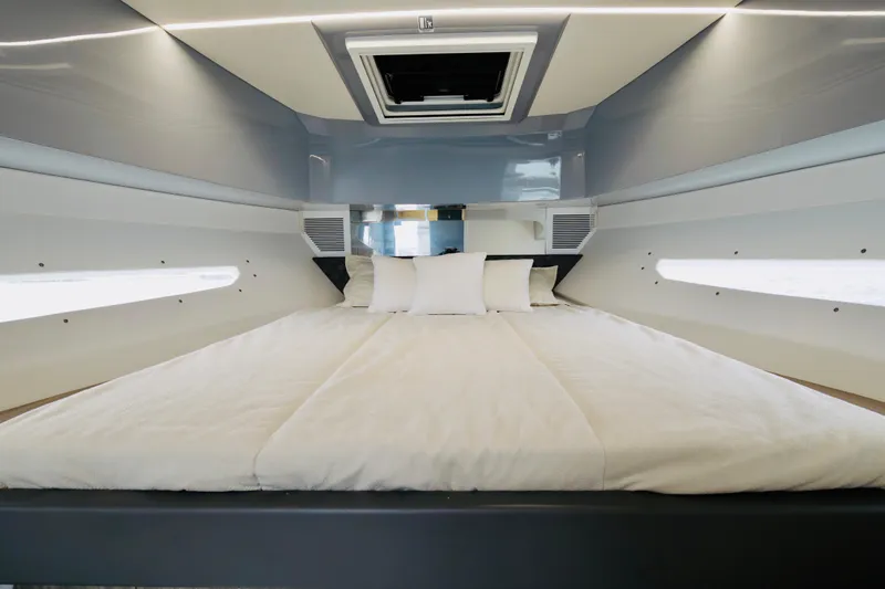  Yacht Photos Pics Luxurious cabin interior of 2023 Rio Yachts Daytona 34 with modern bedding.