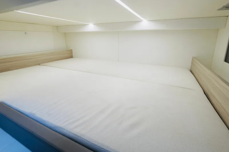 Yacht Photos Pics Interior cabin of 2023 Rio Yachts Daytona 34, featuring a spacious bed and modern design.