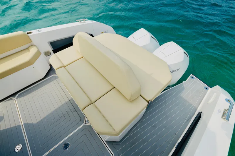  Yacht Photos Pics 2023 Rio Yachts Daytona 34 with beige seating and dual Mercury outboard engines on blue water.