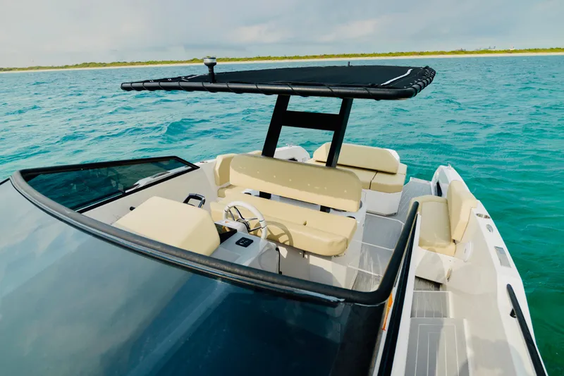  Yacht Photos Pics 2023 Rio Yachts Daytona 34 on turquoise water, featuring sleek design and comfortable seating.