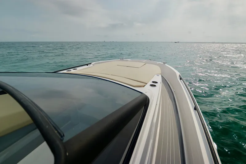  Yacht Photos Pics 2023 Rio Yachts Daytona 34 cruising on open sea under cloudy sky.