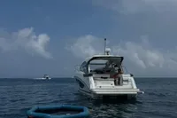 2024 Bavaria Sport 36 Open yacht on calm sea under cloudy sky.