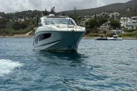 2024 Bavaria Sport 36 Open yacht on calm water, scenic coastal backdrop.