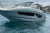 2024 Bavaria Sport 36 Open yacht on calm blue water under a clear sky.