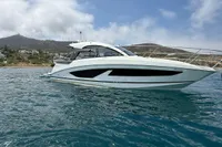 2024 Bavaria Sport 36 Open yacht cruising on clear blue water under a partly cloudy sky.