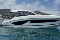 2024 Bavaria Sport 36 Open yacht on clear blue water under a sunny sky.