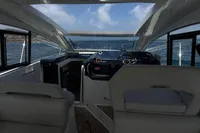 Interior view of 2024 Bavaria Sport 36 Open yacht, featuring sleek design and ocean backdrop.