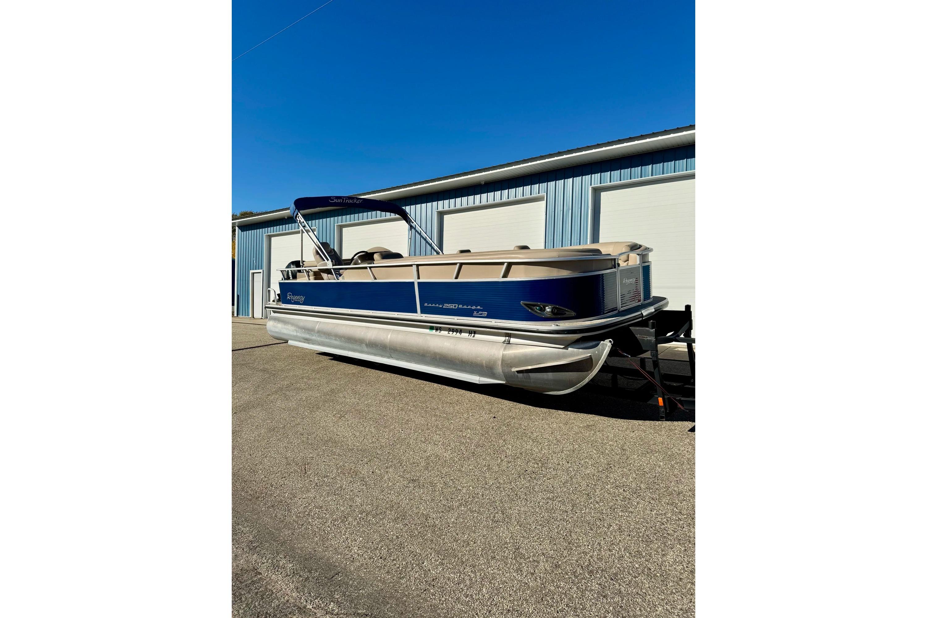 2012 Regency Sun Tracker Party Barge pontoon boat parked outdoors.