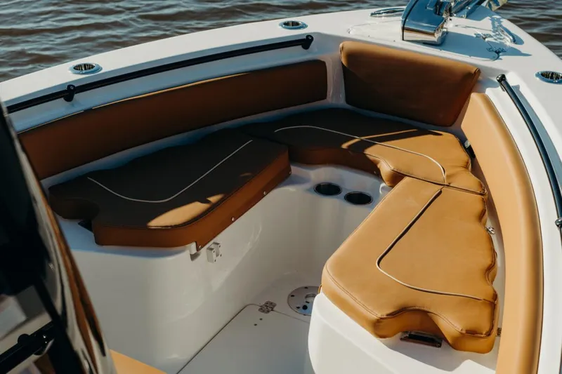  Yacht Photos Pics Manufacturer Provided Image: 2025 Key West 239 FSR boat interior with tan cushioned seating and cup holders.