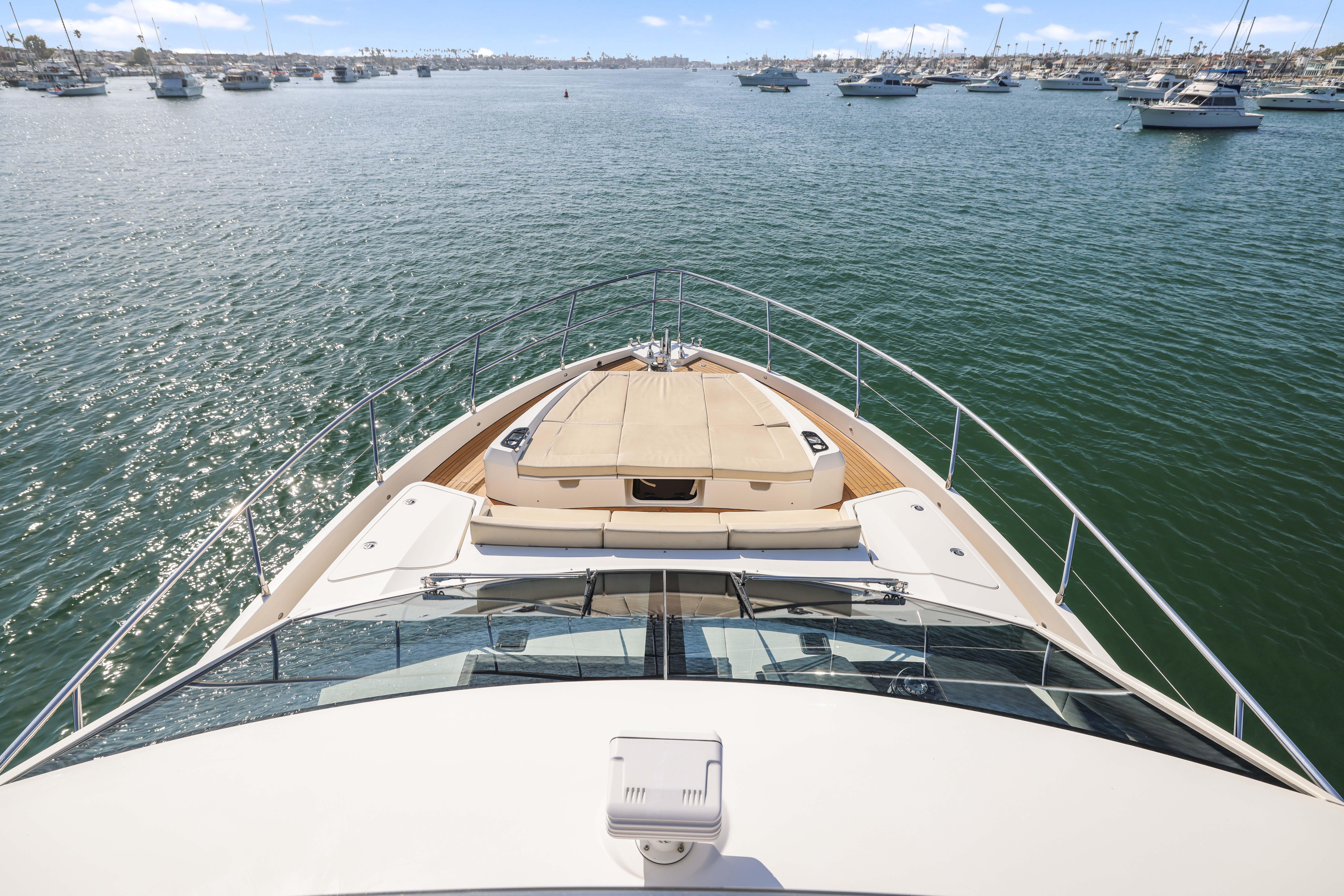 Bow view of 2015 Absolute Fly Co Ownership yacht on calm waters.