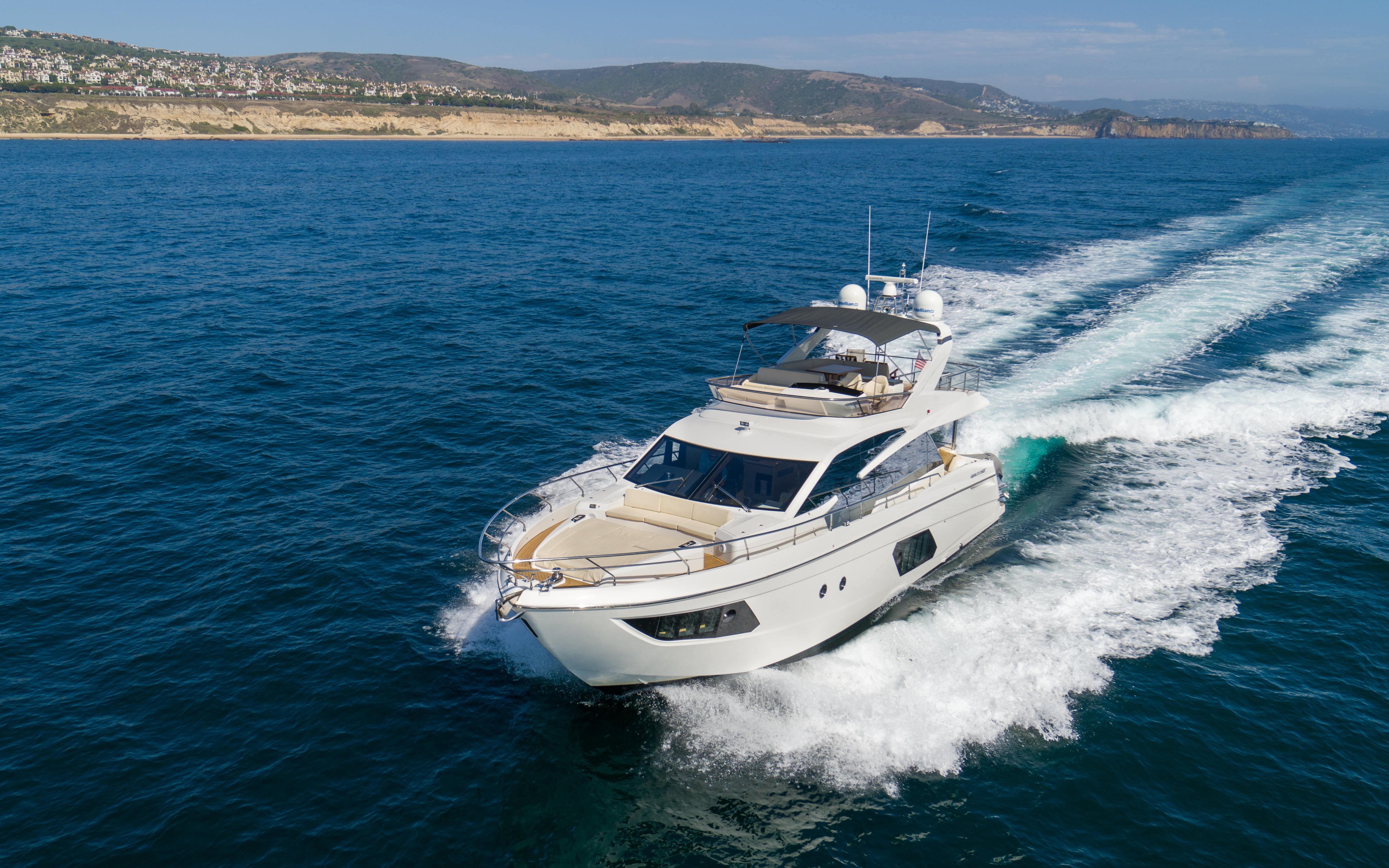 Luxury yacht cruising on open sea, Absolute Fly Co Ownership 2015 model.