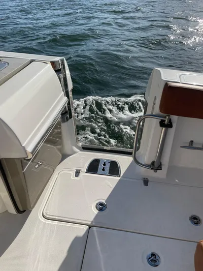 Getting There Yacht Photos Pics 2017 Boston Whaler Vantage 320 boat deck with ocean view.