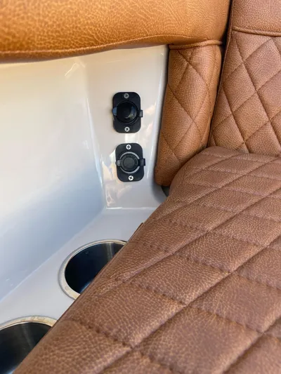 Getting There Yacht Photos Pics 2017 Boston Whaler Vantage 320 interior with quilted leather seats and cup holders.