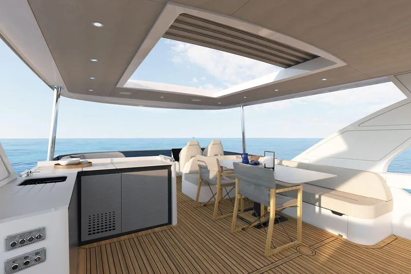  Yacht Photos Pics Luxurious 2026 Absolute NAVETTA 58 yacht deck with modern seating and ocean view.