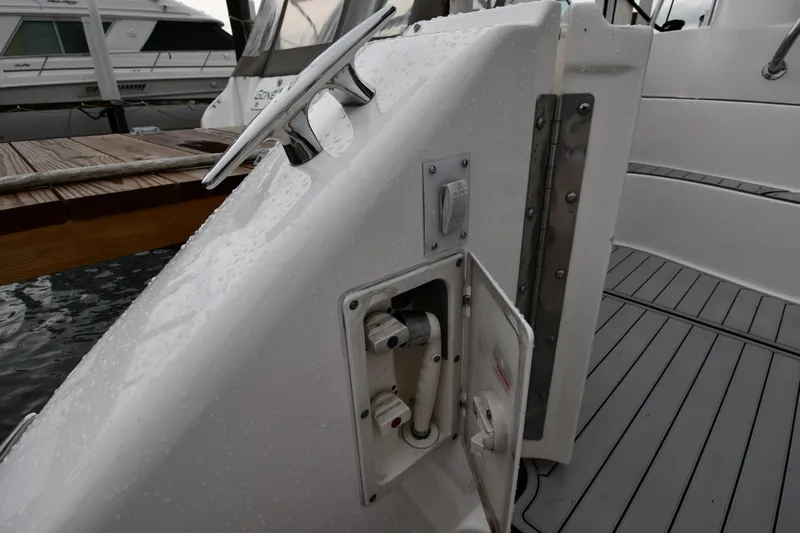 007 Yacht Photos Pics 2001 Sea Ray 480 Sedan Bridge yacht, showing deck details and dock connection.