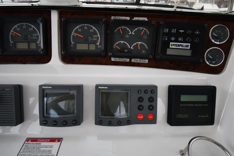007 Yacht Photos Pics Control panel of a 2001 Sea Ray 480 Sedan Bridge with gauges and navigation equipment.