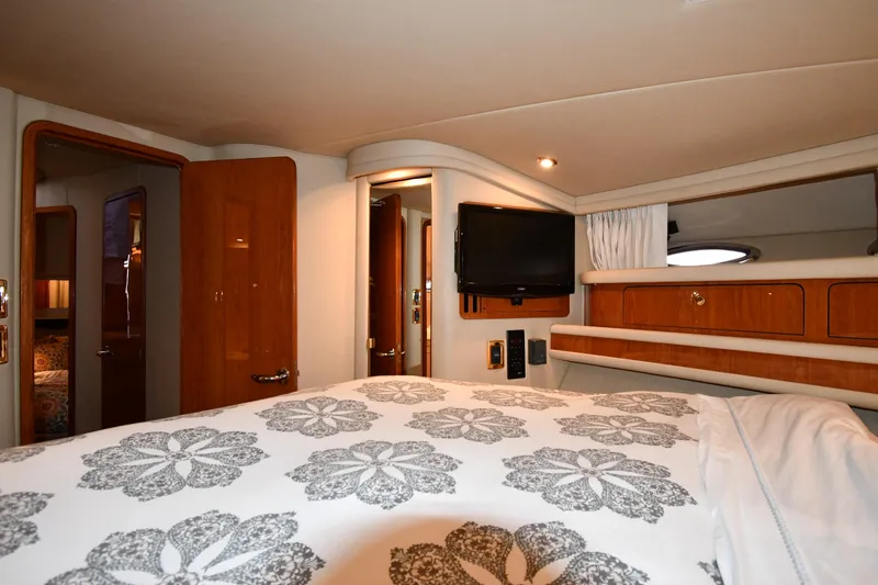 007 Yacht Photos Pics Luxurious cabin interior of 2001 Sea Ray 480 Sedan Bridge yacht with elegant bedding.