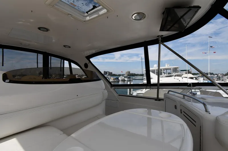007 Yacht Photos Pics Interior view of 2001 Sea Ray 480 Sedan Bridge yacht with marina backdrop.