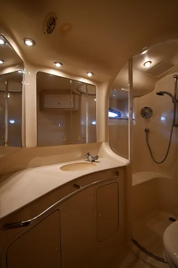 007 Yacht Photos Pics Luxurious bathroom in 2001 Sea Ray 480 Sedan Bridge yacht with modern fixtures.