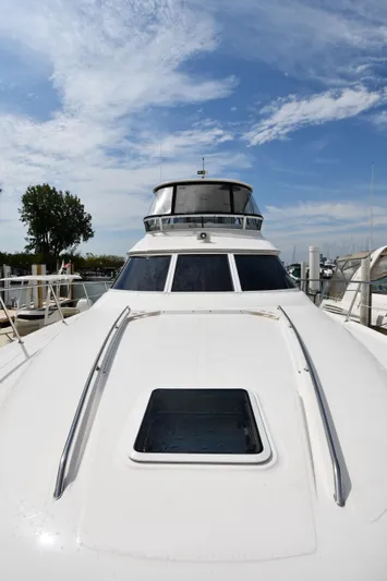 007 Yacht Photos Pics 2001 Sea Ray 480 Sedan Bridge yacht with sleek design under a clear blue sky.