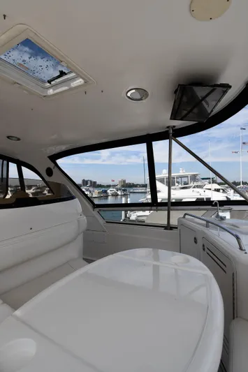 007 Yacht Photos Pics 2001 Sea Ray 480 Sedan Bridge interior with marina view through large windows.