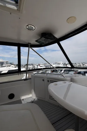 007 Yacht Photos Pics 2001 Sea Ray 480 Sedan Bridge interior with marina view.