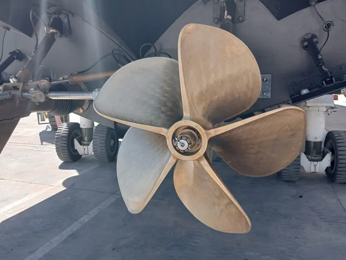 Oxygen III Yacht Photos Pics Propeller of 2007 Pershing 56 yacht, docked, showcasing its metallic blades.