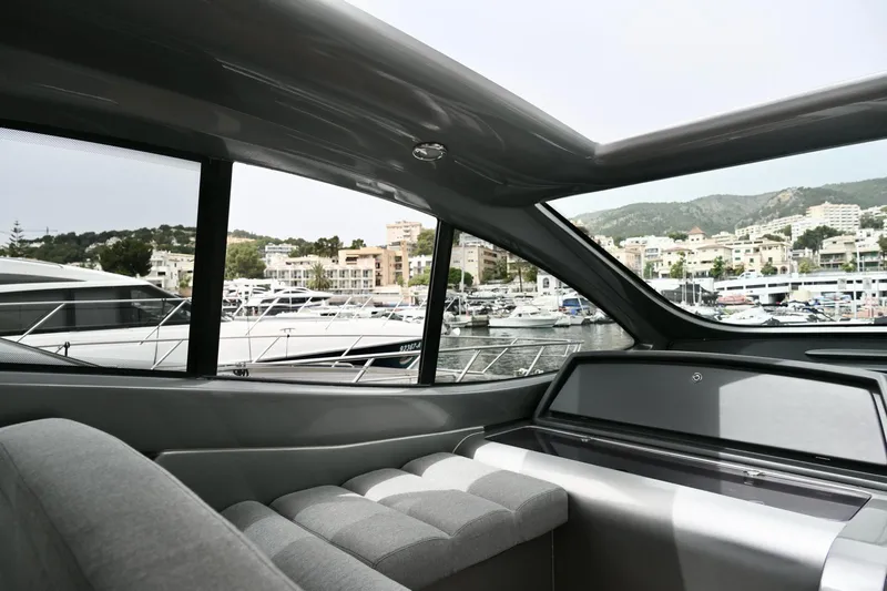 Oxygen III Yacht Photos Pics Interior view of a 2007 Pershing 56 yacht with marina backdrop.